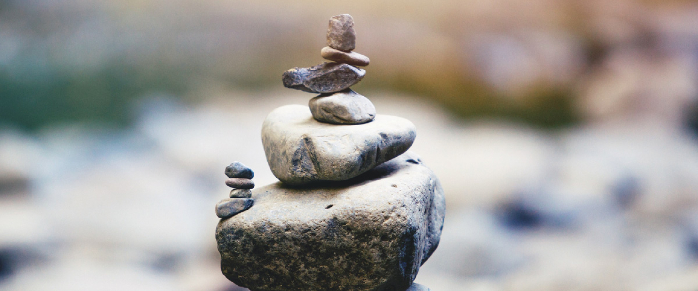 close up image of stacked stones with background out of focus