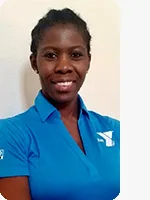 headshot of female personal trainer wearing blue YMCA polo beige background