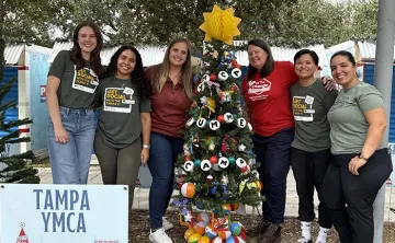 YMCA Association Office Staff in Curtis Hixon by our Holiday Tree.